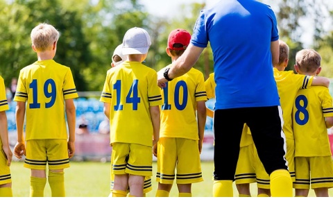 Soccer Coach Interacting with their team Soccer Coach Interacting with their team